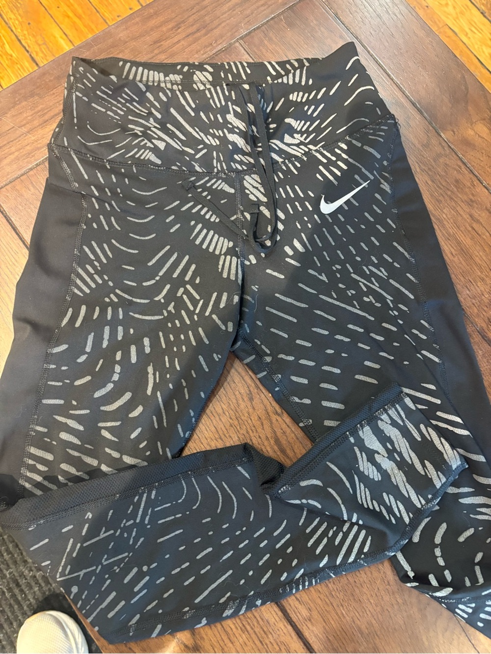 Woman’s Nike size small REFELECTIVE full length running pants. ONLY worn once